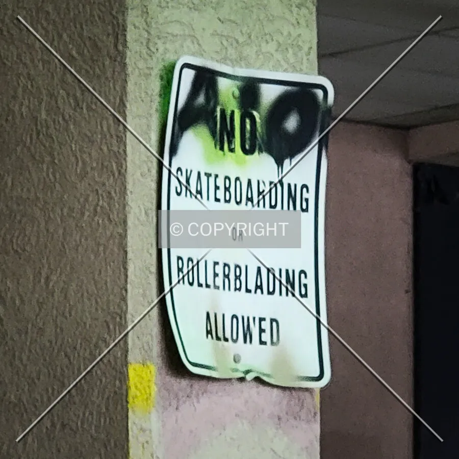 A sign in the Dillard's covered parking area; October 28, 2023