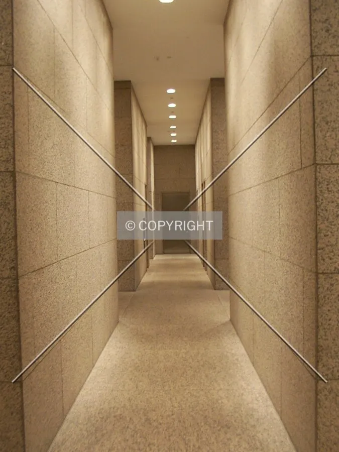 Transverse corridor between elevator banks, ground floor