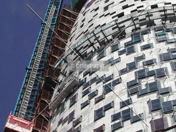 View of the second third facade, the elevators and the crane