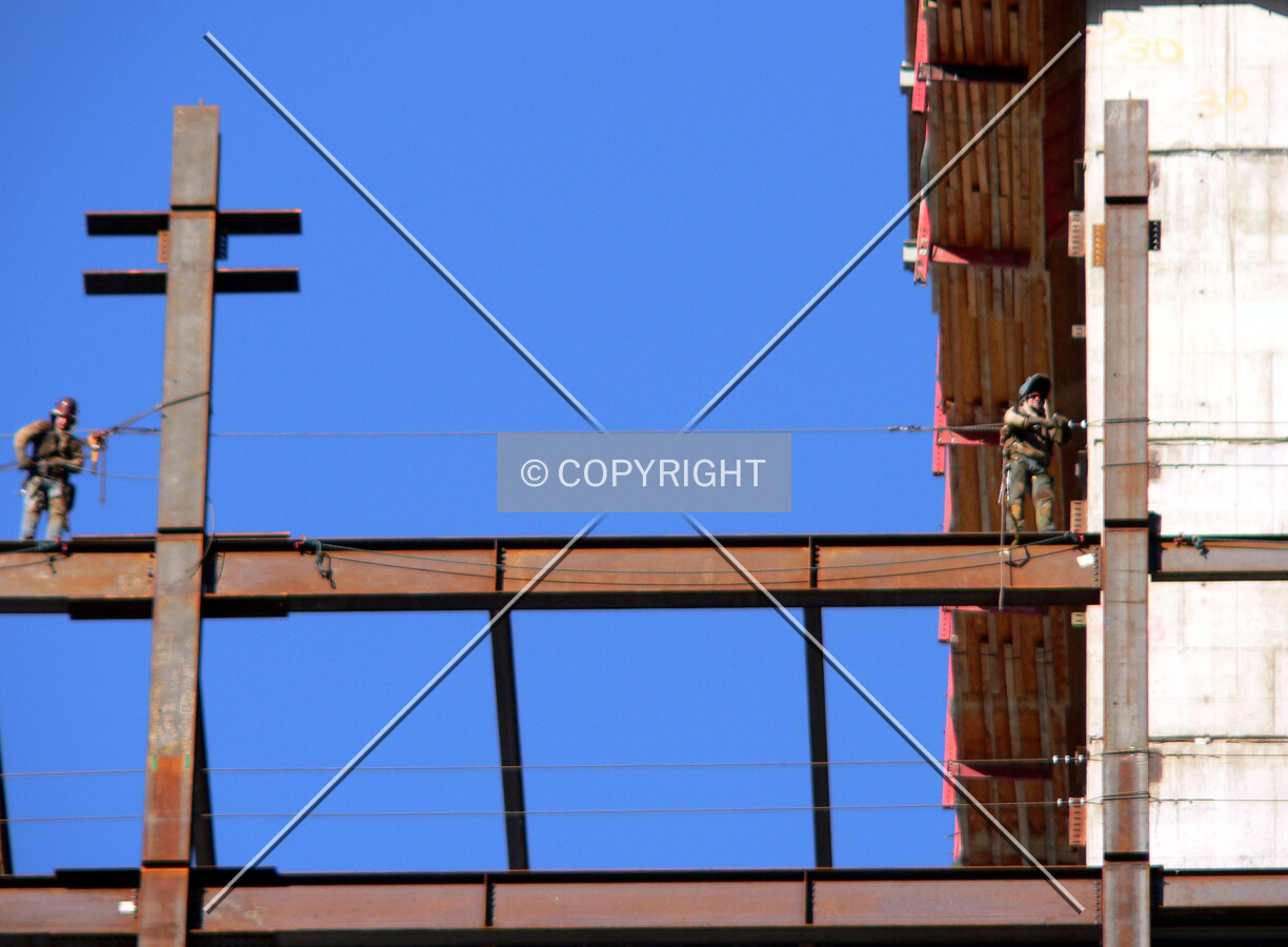 Workers on the beams