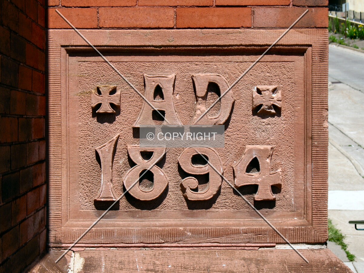 Cornerstone in terra cotta